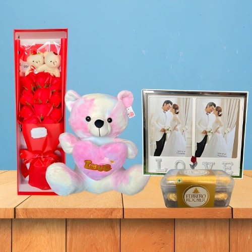 Romantic Red Rose Bouquet Combo with Twin Dolls, Rainbow Heart Teddy, LED Photo Frame & Chocolates
